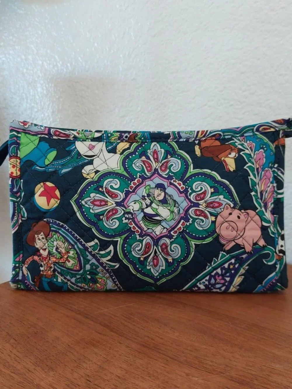 vera bradley Disney Toy Story quilted pouch with characters in a paisley design